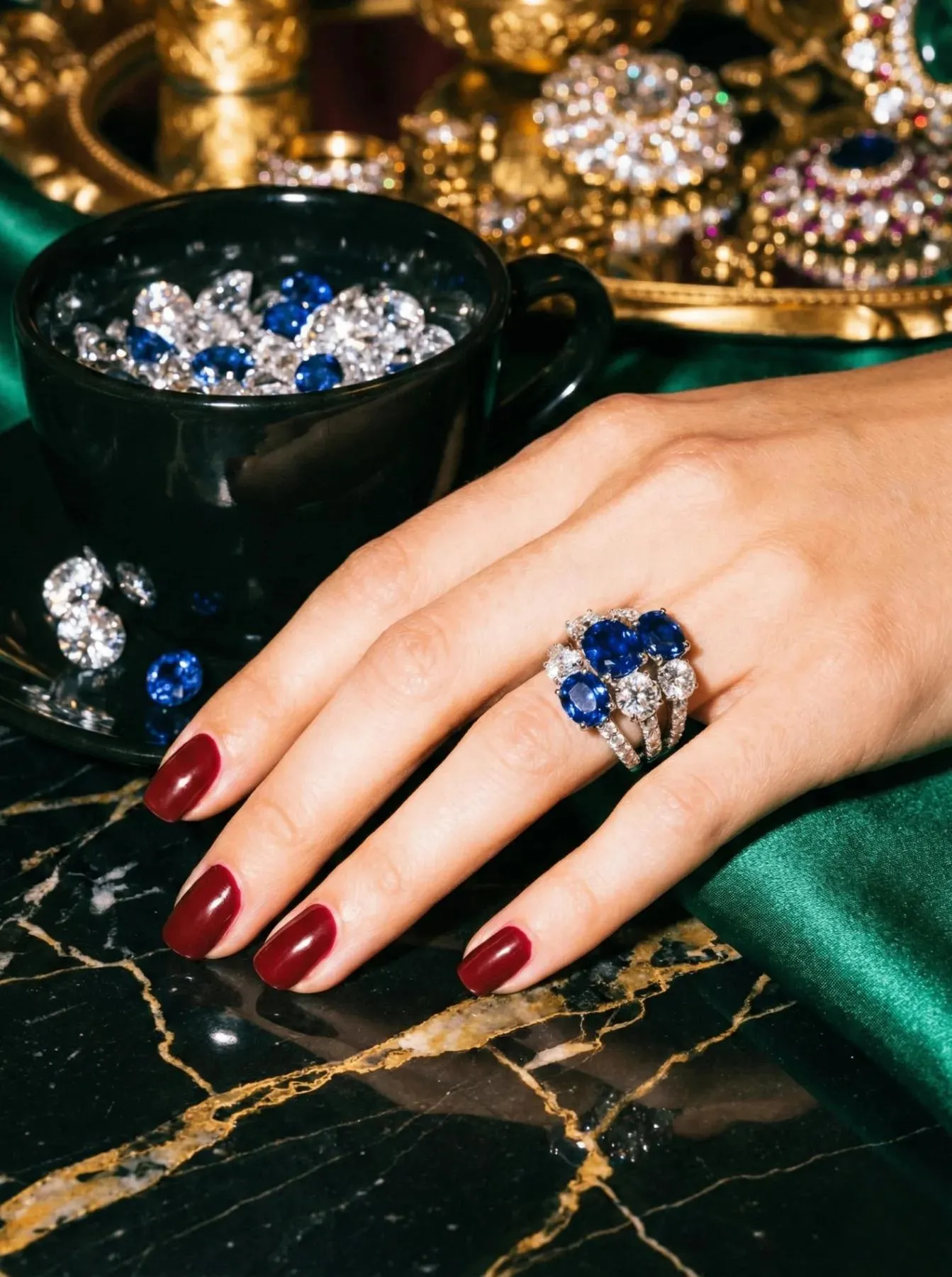 Sapphire cocktail ring framed in diamonds